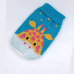 Knitted pet sweater with giraffe design on a white background