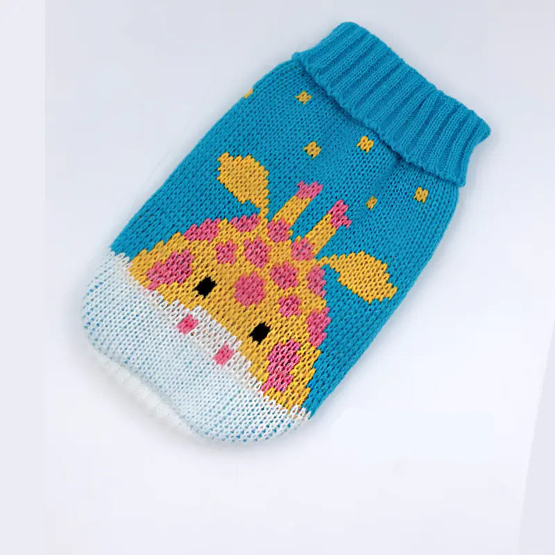 Knitted pet sweater with giraffe design on a white background