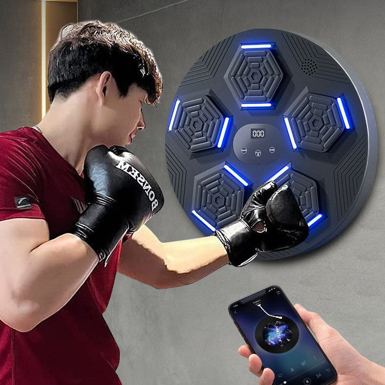 Person wearing boxing gloves using a smart device with Bluetooth connection on a dark background