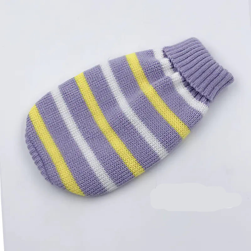 Striped knitted pet sweater with purple, yellow, and white colors on a light gray background.