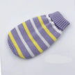 Striped knitted pet sweater with purple, yellow, and white colors on a light gray background.