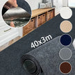 Roll of gray carpet with dimensions 40x3m, shown indoors with a bench and baskets.