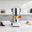 High-speed grinder with ingredients and products on a table