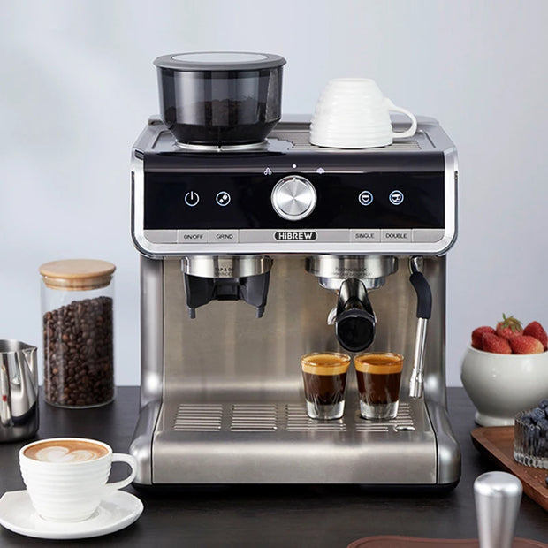 Coffee machine with two cups of coffee on a table