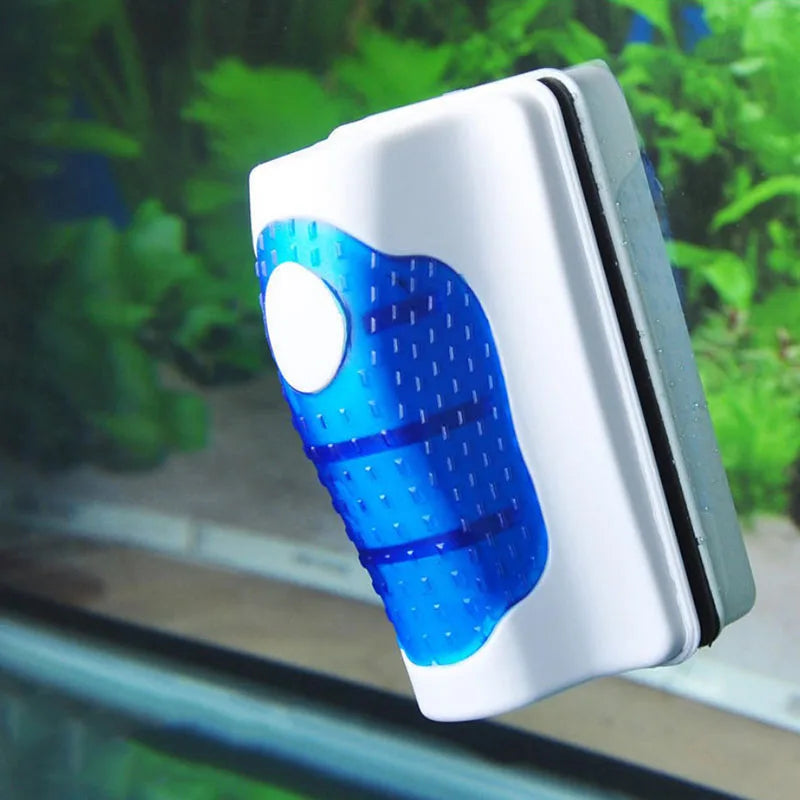 Cleaning tool with blue bristle brush on a reflective surface