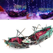Model of a pirate ship in an aquarium setting with lights and water effects.