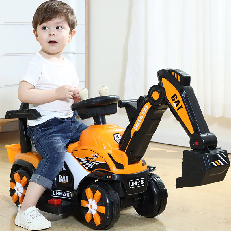 Child sitting on a toy excavator with 'CAT' branding indoors.