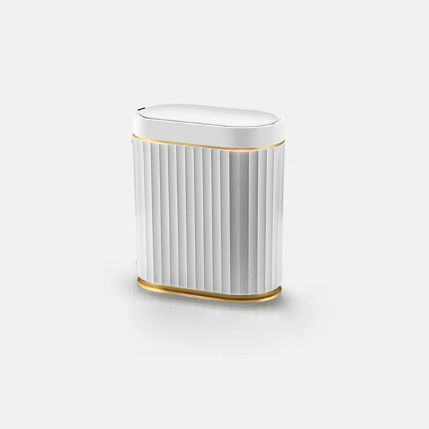 White cylindrical object with gold accents on a white background