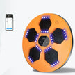 Orange electronic device with black hexagonal pads and LED lights on a white background