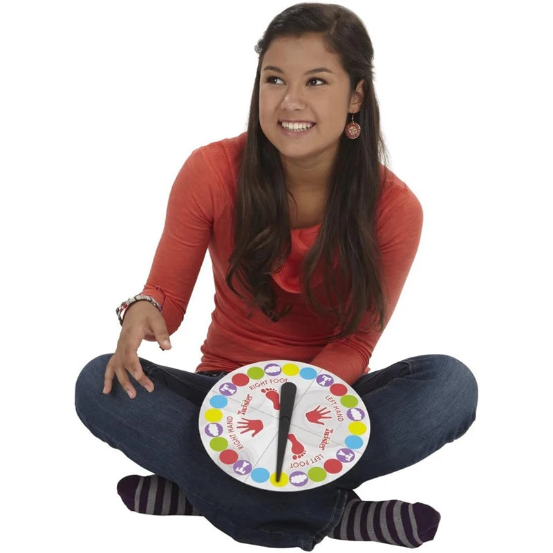 Person holding a colorful wheel with various symbols on a white background
