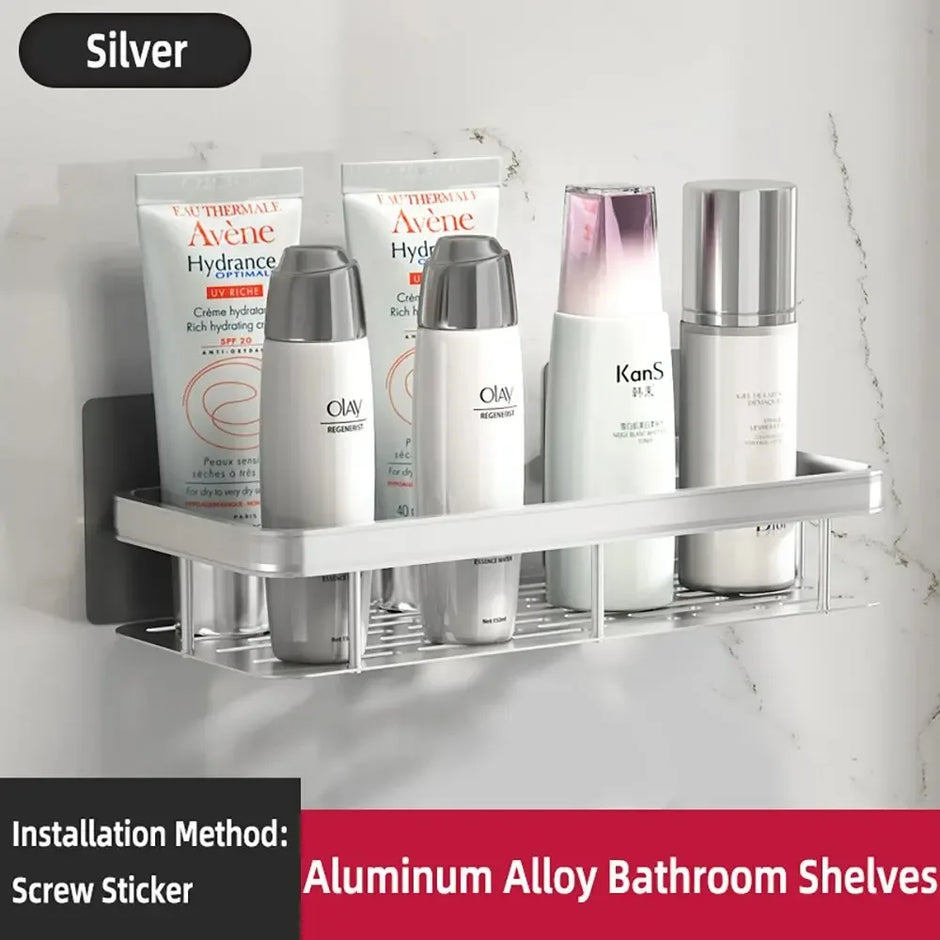 Aluminum alloy bathroom shelves with skincare products on a white marble wall.