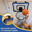 Child playing with a door-mounted basketball hoop and ball.