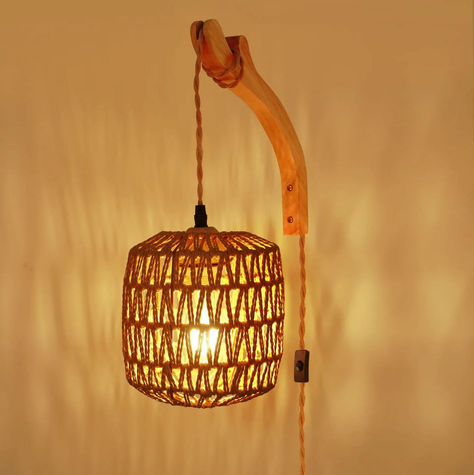 Woven pendant light with wooden arm against a warm beige background