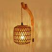 Woven pendant light with wooden arm against a warm beige background