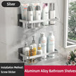 Aluminum alloy bathroom shelves with toiletries on a marble wall.