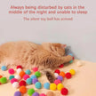 Cat playing with colorful toy balls on a surface, with text above.