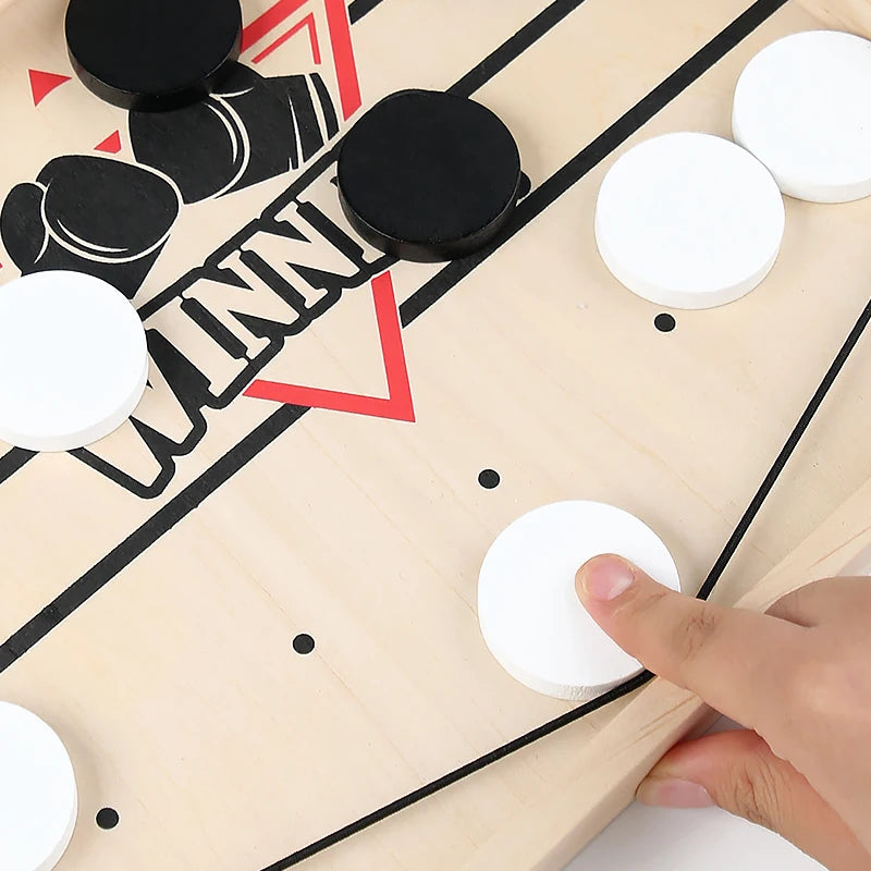 Hand placing a white disc on a game board with black and red markings