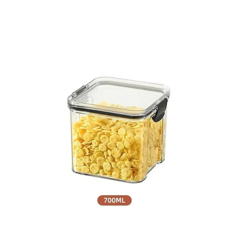 Clear container with yellow cereal, 700ML label on a white background
