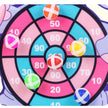 Colorful target game with numbered sections and toy darts on a white background