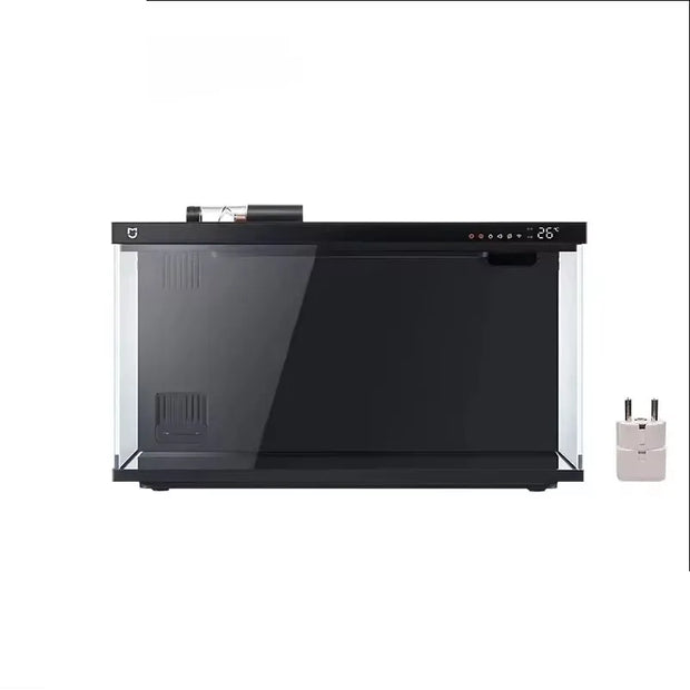 Black aquarium with clear front panel and a power adapter on a white background