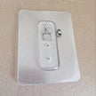 Clear plastic wall plate with mounting hardware on a beige background