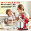 Woman and child in a kitchen with a red stand mixer, enjoying delicacies together.