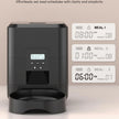 Black pet feeder with digital display and scheduled meal timers on a beige background