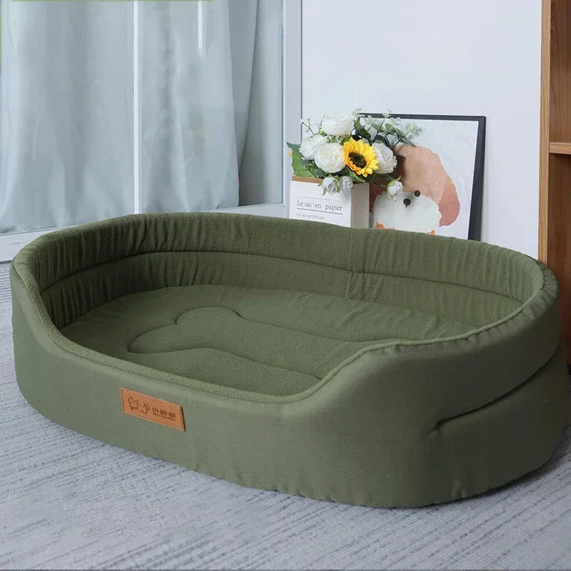 Green pet bed on a carpeted floor with a blurred background