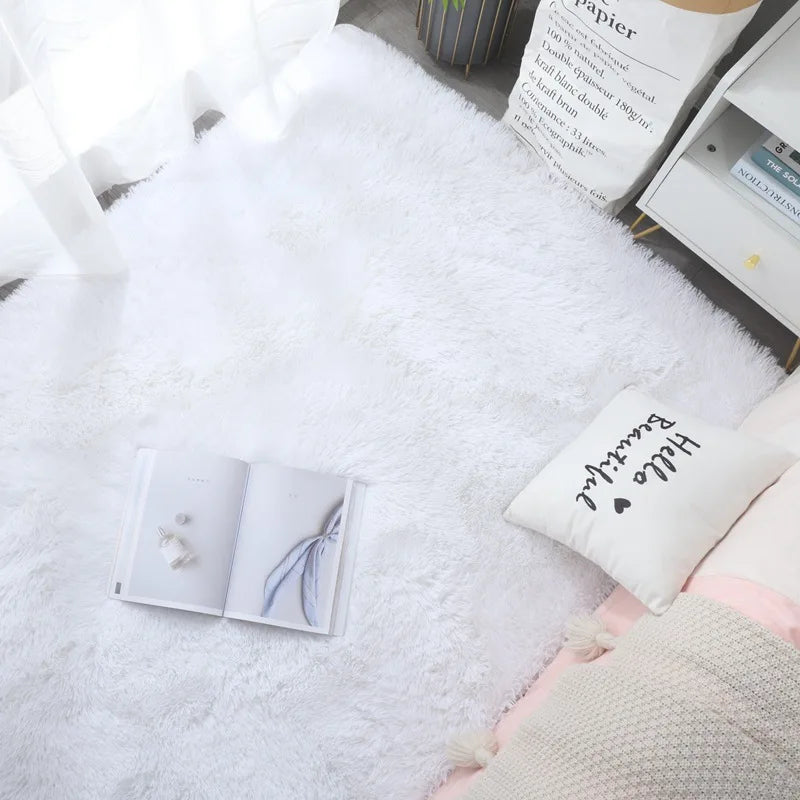 White towel with a small card and pen on a white surface