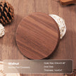 Round wooden coaster on a wooden surface with product details.