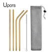 Set of gold metal straws with a cleaning brush and mesh pouch on a white background, branded 'Upors'.