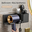 Bathroom wall organizer with hair dryer, brush, and other items on a textured wall.