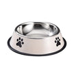 Stainless steel dog bowl with black paw prints on a white background