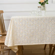 Tablecloth with floral pattern on a wooden table in a room setting