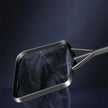 Metallic strainer with dark blue mesh on a dark background
