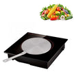 Induction cooktop with a frying pan on a white background, accompanied by an inset of vegetables.