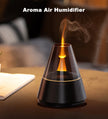 Aroma air humidifier with flame on a wooden surface
