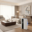 White electronic device with digital display in a room with shelves and clothes.