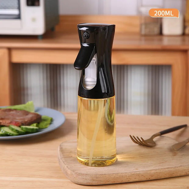 Oil spray bottle with oil on a wooden surface in a kitchen setting