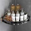 Corner shower caddy with various bottles and containers on a gray tiled wall background