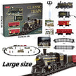 Toy train set with locomotive, cars, and tracks on a white background