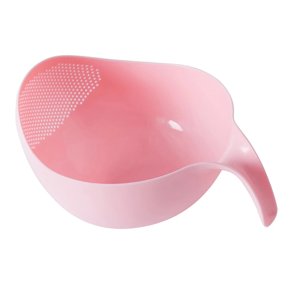 Pink face cleaning brush with a white background