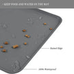Gray mat with food and water spillage, labeled features, on a white background