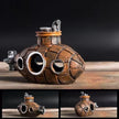 Steampunk-style submarine model on a wooden surface with a dark background