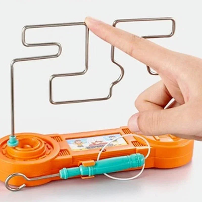 Orange electronic device with a metal coil and digital display, held by a hand.