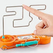 Orange electronic device with a metal coil and digital display, held by a hand.