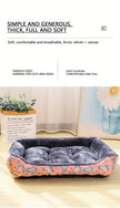 Pet bed with pink and white pattern on a light wooden floor.