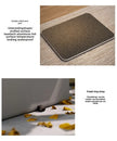 Doormat with text describing features on a wooden floor.