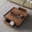 Wooden coffee table with storage drawers in a living room setting