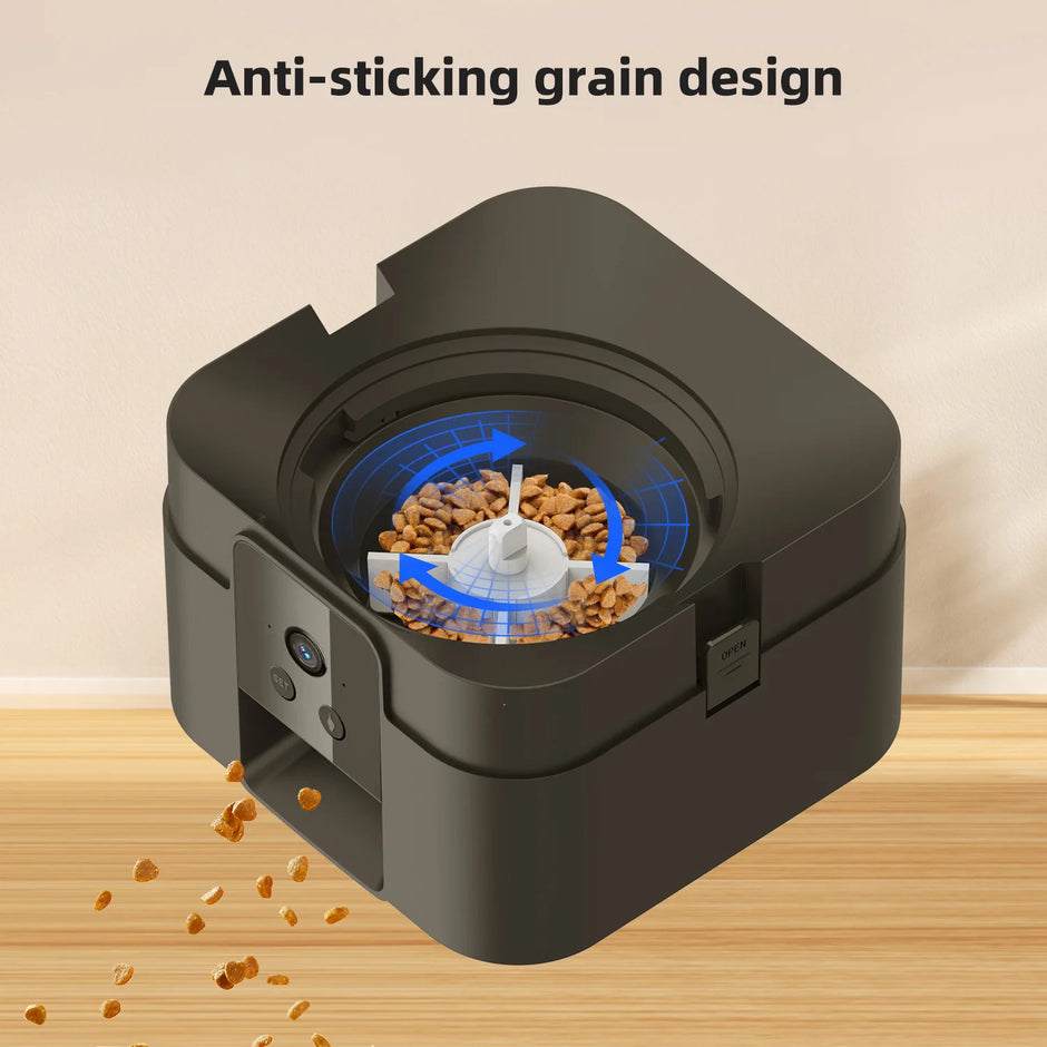Pet food dispenser with anti-sticking grain design on a wooden surface.